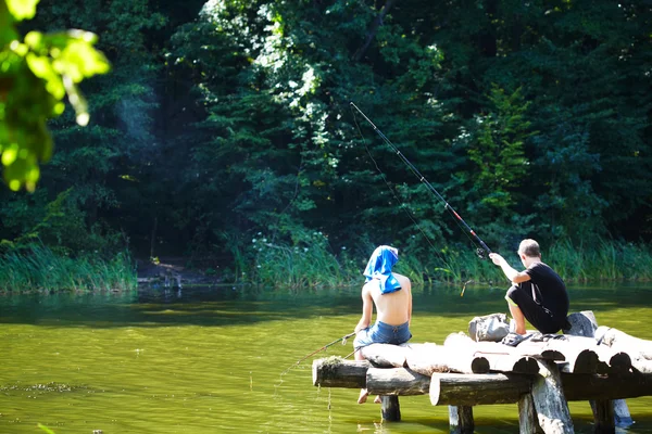 Two boys fishing on the lake — Stock Photo, Image