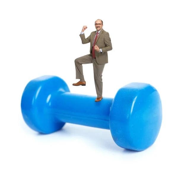 Businessman and blue dumbbells — Stock Photo, Image