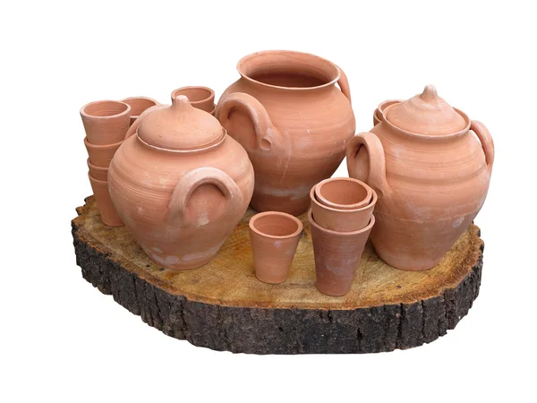 Clay pots on wooden support isolated over white — Stock Photo, Image