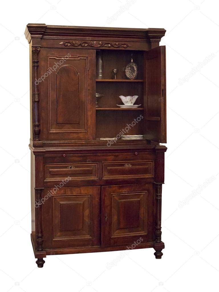 19th century wood sideboard with vintage objects in it isolated