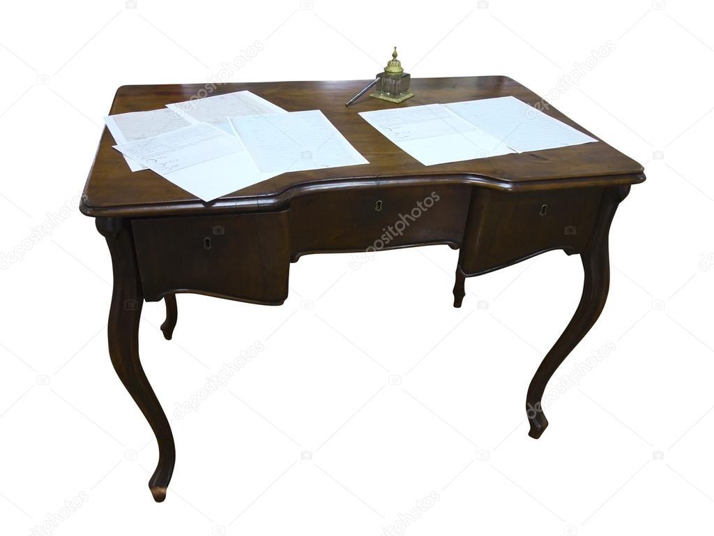 Vintage writind desk with paper and inkwell isolated on white