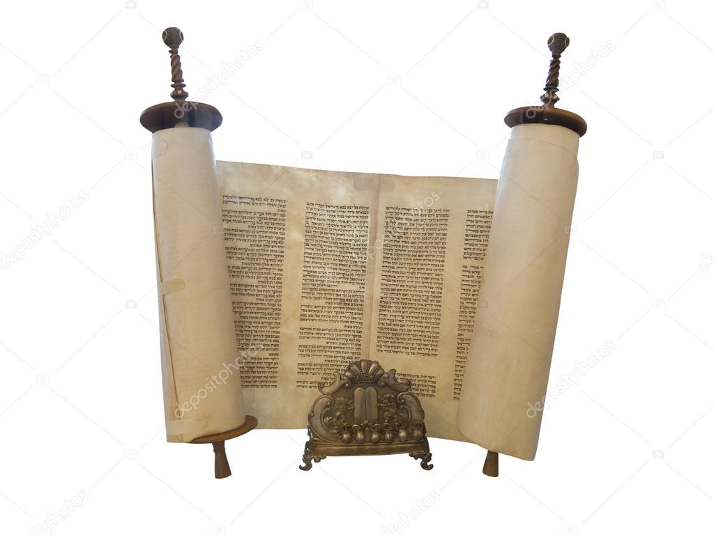 The Jewish Torah scroll and a gold menorah candle support isolat