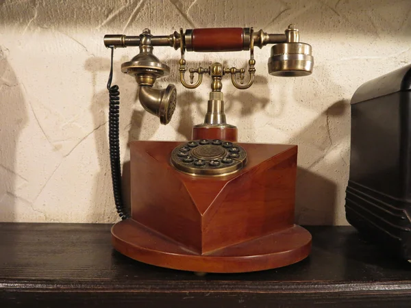 Vintage old style wooden phone with retro disc dial — Stock Photo, Image