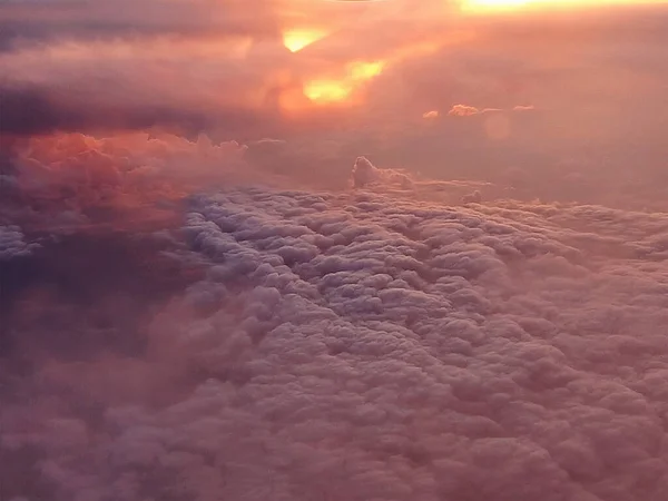 Dramatic red storm clouds. Aerial view over the clouds.