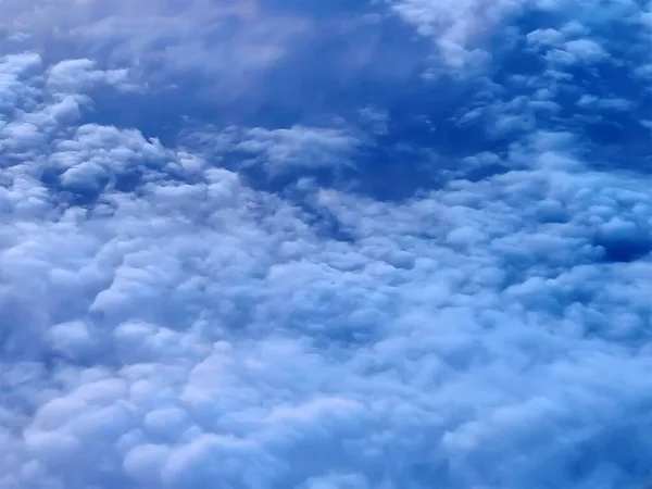 Dramatic blue storm clouds. Aerial view over the clouds.
