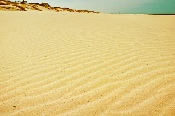 Sandmuster Auf Dem Strand Hintergrund Natur lizenzfreie Stockbilder