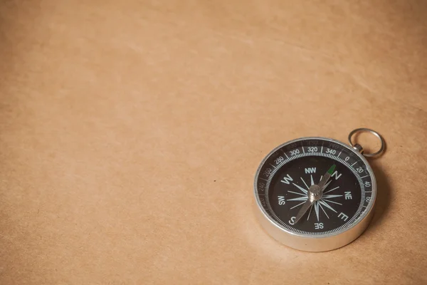 Compass on Light Brown Background — Stock Photo, Image