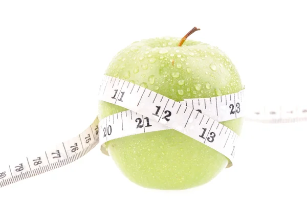 Zielone jabłko mierzony licznikiem — Zdjęcie stockowe