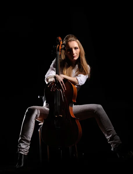 Attractive girl with cello isolated over black background — Stock Photo, Image