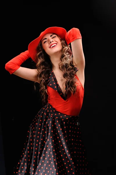 Studio portrait of beautiful sexy girl in red hat — Stock Photo, Image