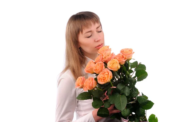 Menina sexy com buquê de rosas nas mãos isoladas sobre branco — Fotografia de Stock