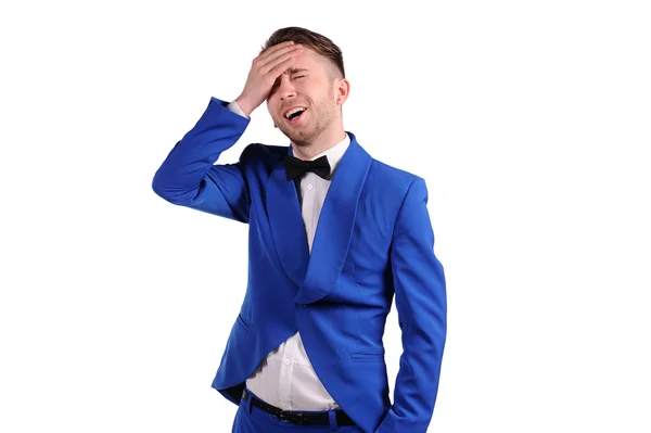 Muž v modrém suite s nevěřící tváří na bílém pozadí — Stock fotografie
