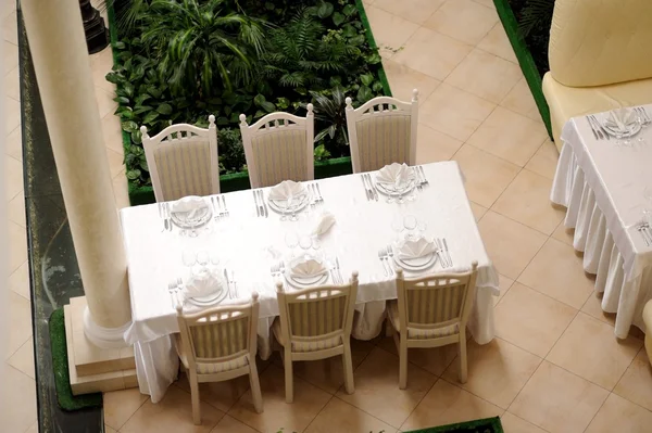 Served table in restaurant with dishes and glasses — Stock Photo, Image