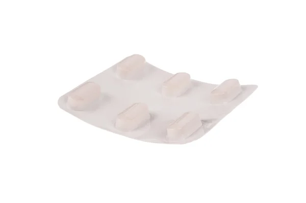 Opakowanie tabletek na białym tle nad białym — Zdjęcie stockowe