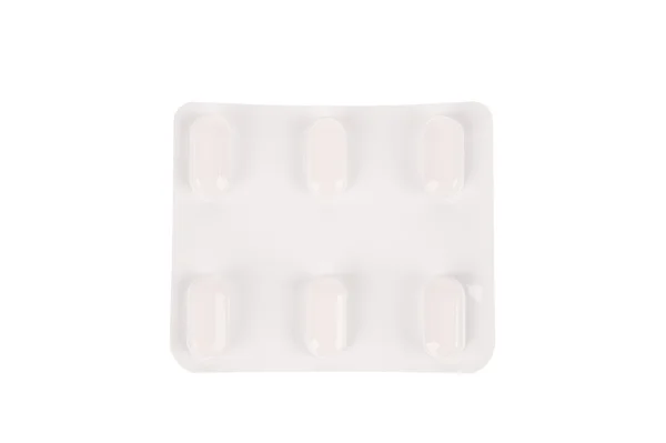 Pacote de pílulas isoladas sobre fundo branco — Fotografia de Stock