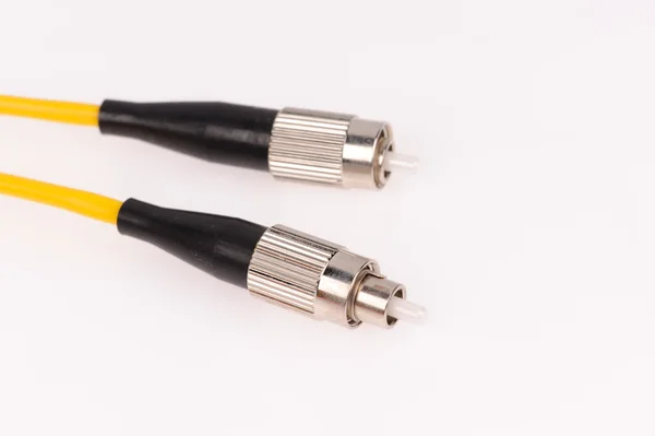Cables de fibra óptica aislados sobre fondo gris —  Fotos de Stock