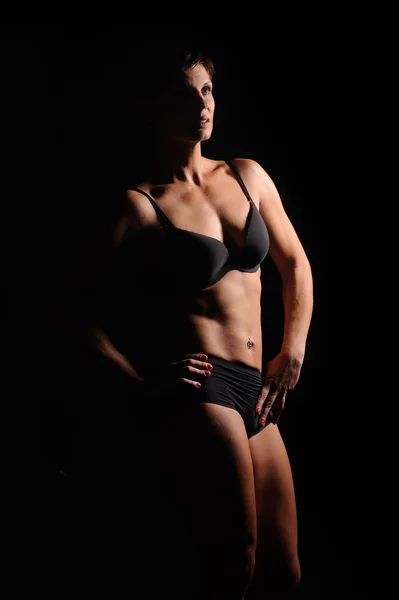 美丽的女性身体上一个黑的背景 — 图库照片