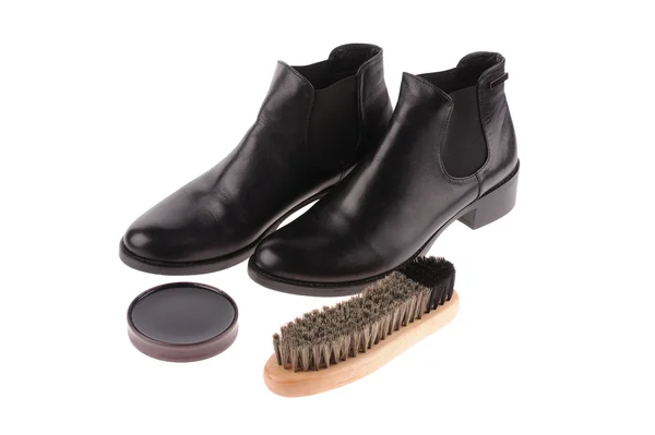 Black boots with shoe brush — Stock Photo, Image