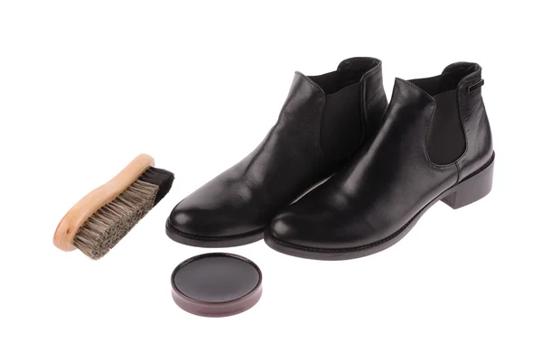 Black boots with shoe brush — Stock Photo, Image