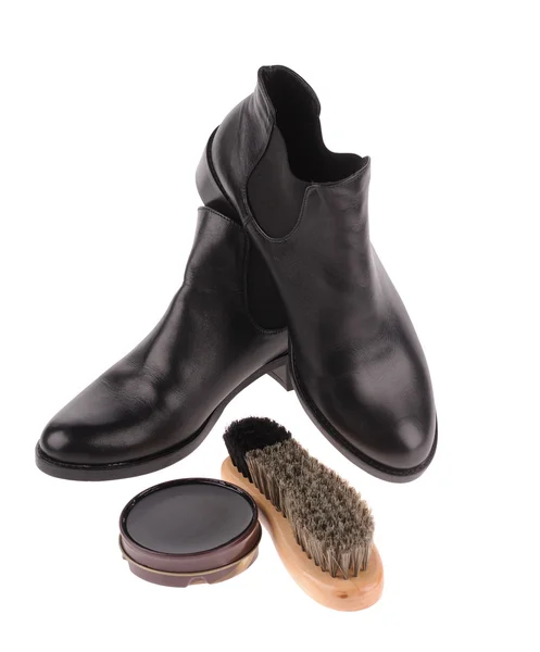 Black boots with shoe brush — Stock Photo, Image