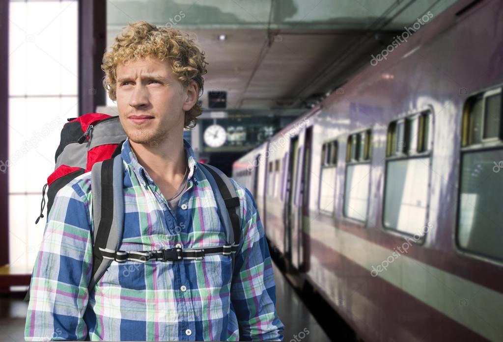 Young man traveling by train