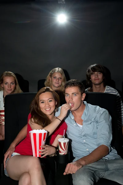 Friends watching movie at cinema — Stock Photo, Image