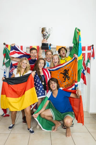 Successful Athletes With Various National Flags Royalty Free Stock Images