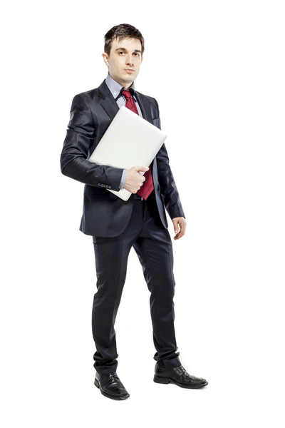 Atractivo joven hombre de negocios con portátil en el fondo blanco — Foto de Stock