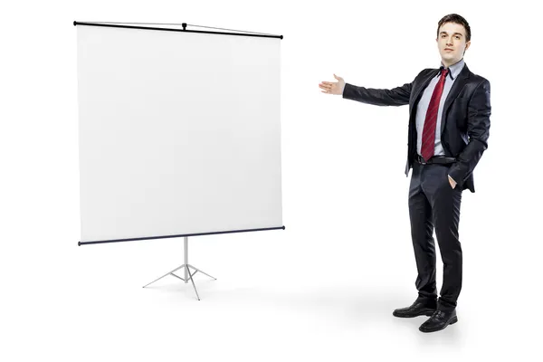 Businessman pointing to a blank board on white background — Stock Photo, Image