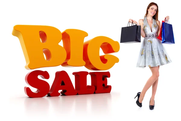 Junge Frau mit Einkaufstaschen und einem großen 3D-Verkaufstext — Stockfoto