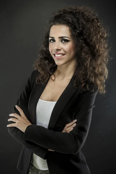 Portrait of a young attractive woman with beautiful curly hair — Stock Photo, Image