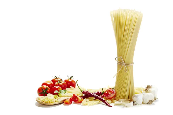 Italian pasta with tomatoes, garlic and red chilli pepper on white backgroun — Stock Photo, Image