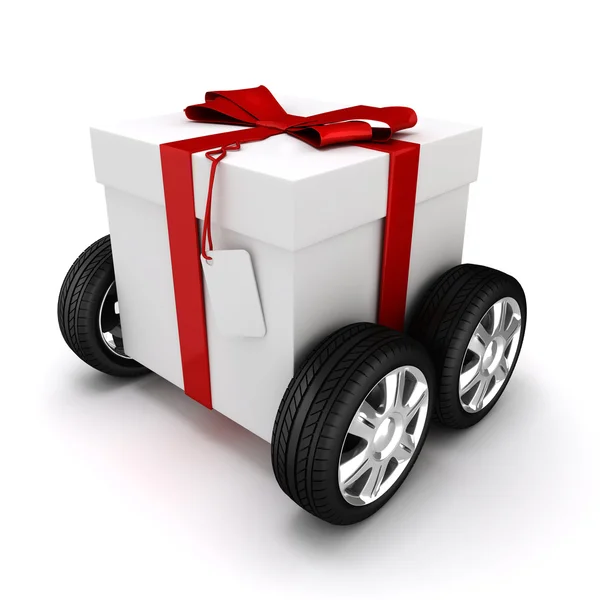 3d caixa de presente com arco vermelho sobre rodas — Fotografia de Stock