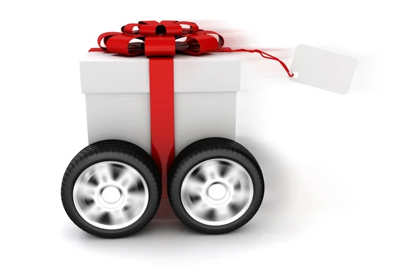 3D подарункова коробка з червоним бантом на колесах — стокове фото