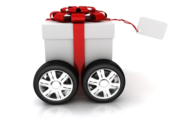 3d caixa de presente com arco vermelho sobre rodas — Fotografia de Stock
