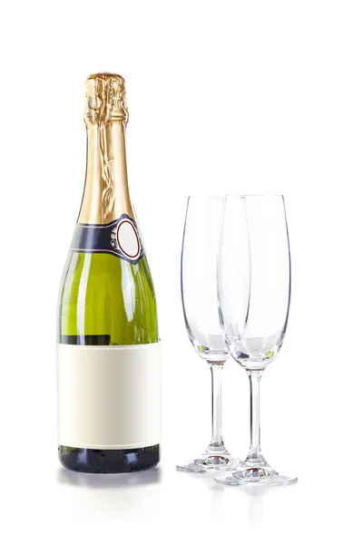 Champagne bottle and two crystal glasses on white baclground — Stock Photo, Image