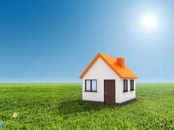 3D-huis, groen gras en heldere blauwe hemel — Stockfoto
