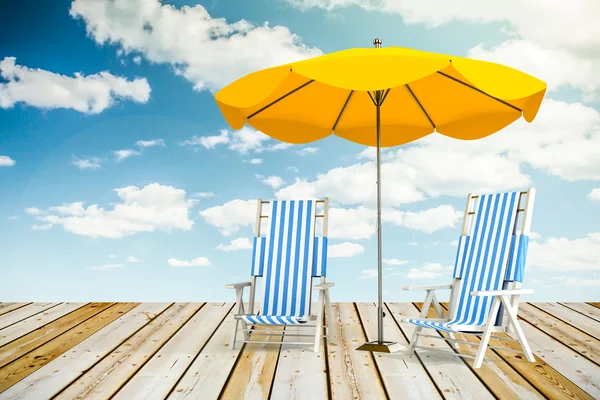 Sun loungers and umbrella — Stock Photo, Image