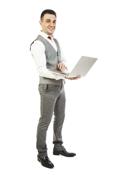 Young attractive businessman with laptop on white background — Stock Photo, Image