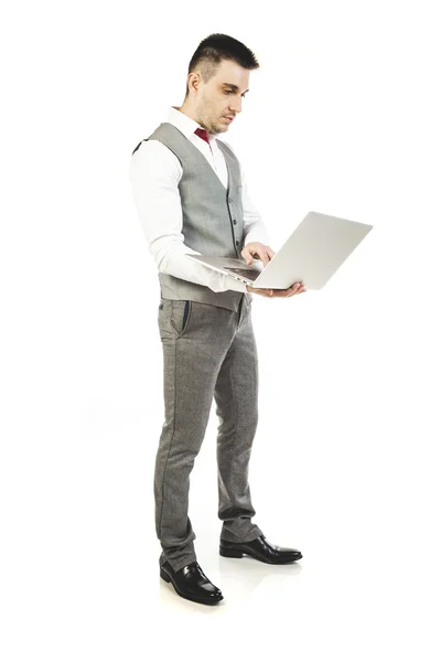 Young attractive businessman with laptop on white background — Stock Photo, Image