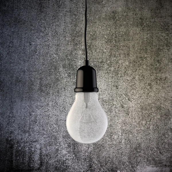 3d light bulb on vintage concrete wall — Stock Photo, Image