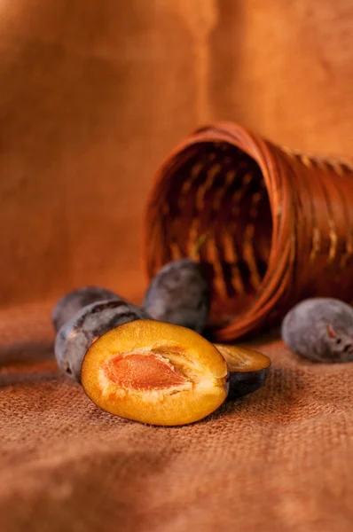 Plum on table and a punnet — Stock Photo, Image