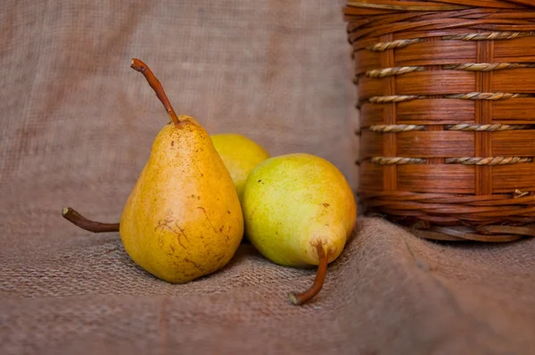 Pear and punnet — Stock Photo, Image