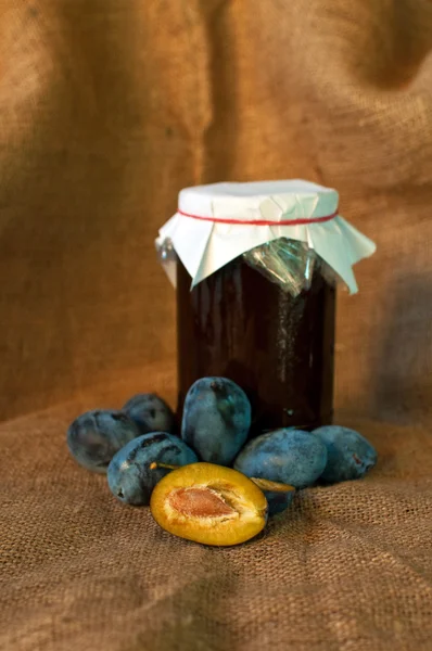 Plum on table and a punnet — Stock Photo, Image