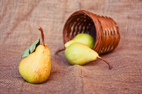 Pear and punnet — Stock Photo, Image