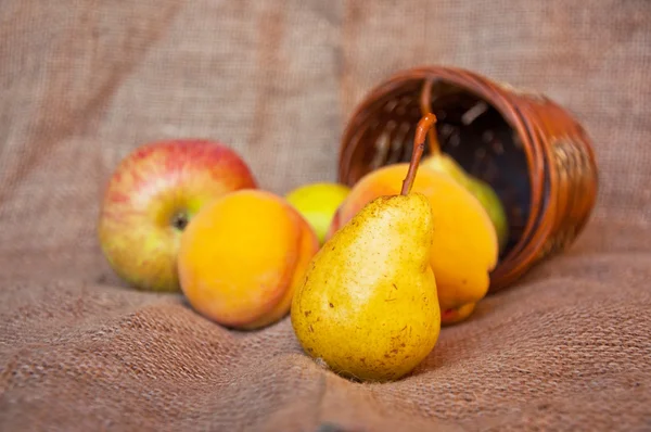 Pear and punnet — Stock Photo, Image