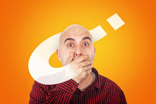 Man with hand on mouth hooked on questions — Stock Photo, Image