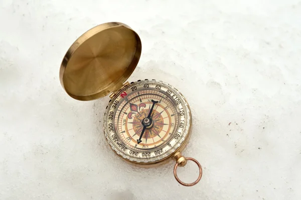 Compass in the snow — Stock Photo, Image