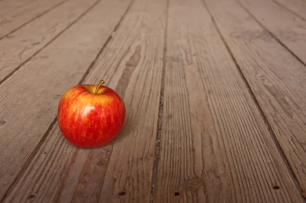 Apple on table — Stock Photo, Image