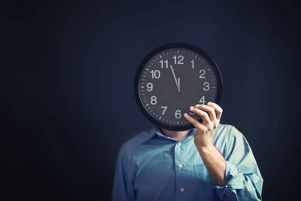 Businessman with black clock, deadline concept — Stock Photo, Image